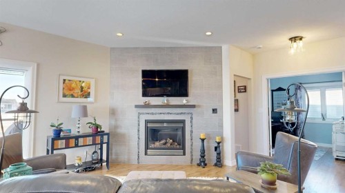 4020 Monarch Way, Stettler, AB - Indoor Photo Showing Living Room With Fireplace