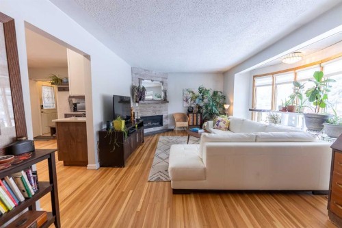 3901 50A Street, Red Deer, AB - Indoor Photo Showing Living Room With Fireplace