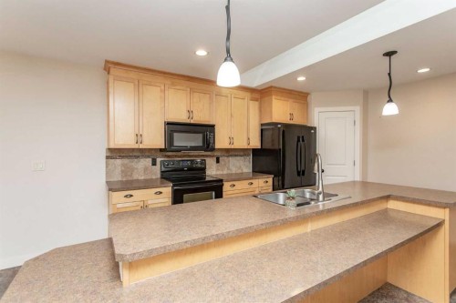 5422 49 Avenue, Lacombe, AB - Indoor Photo Showing Kitchen With Double Sink