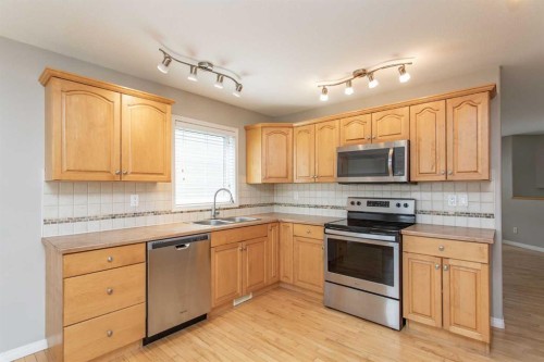 210 Lindsay Avenue, Red Deer, AB - Indoor Photo Showing Kitchen With Stainless Steel Kitchen With Double Sink