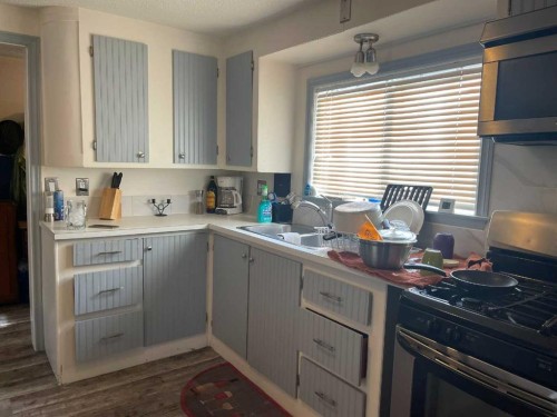 3629 51 Avenue, Red Deer, AB - Indoor Photo Showing Kitchen With Double Sink