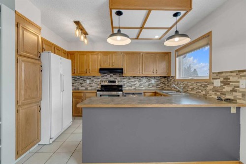 23 Barner Avenue, Red Deer, AB - Indoor Photo Showing Kitchen With Double Sink