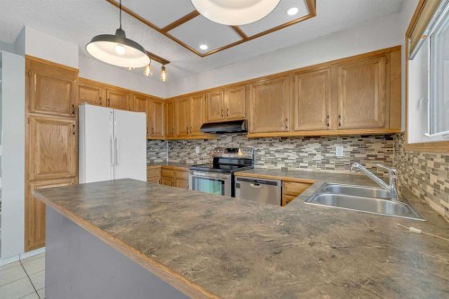 23 Barner Avenue, Red Deer, AB - Indoor Photo Showing Kitchen With Double Sink