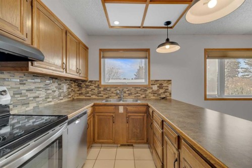 23 Barner Avenue, Red Deer, AB - Indoor Photo Showing Kitchen With Double Sink