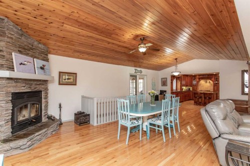606 Pigeon Close, Pelican Point, AB - Indoor With Fireplace