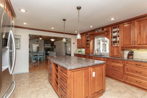 606 Pigeon Close, Pelican Point, AB - Indoor Photo Showing Kitchen With Double Sink