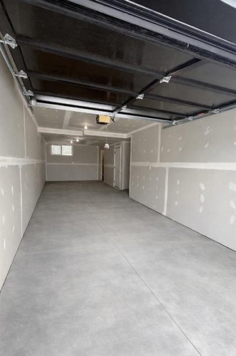 18 Violet Point, Sylvan Lake, AB - Indoor Photo Showing Garage