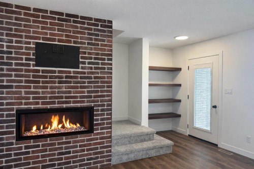 18 Violet Point, Sylvan Lake, AB - Indoor With Fireplace