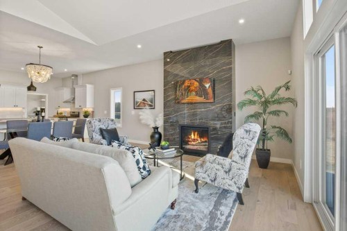 10 Twin Rose Court, Jarvis Bay, AB - Indoor Photo Showing Living Room With Fireplace