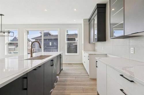 572 Belmont Heath Sw, Calgary, AB - Indoor Photo Showing Kitchen With Double Sink With Upgraded Kitchen