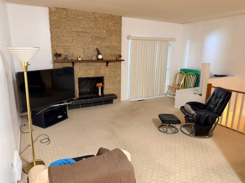 150 Piper Drive, Red Deer, AB - Indoor With Fireplace