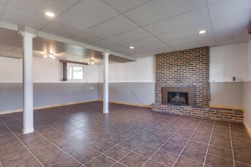 5607 48 Avenue, Lacombe, AB - Indoor With Fireplace