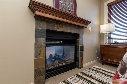 6371 Cedar Way, Innisfail, AB - Indoor With Fireplace