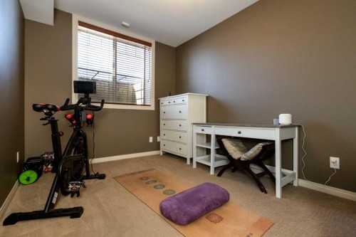 6371 Cedar Way, Innisfail, AB - Indoor Photo Showing Gym Room