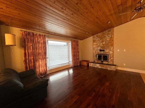 5908 57 Avenue, Ponoka, AB - Indoor Photo Showing Living Room With Fireplace