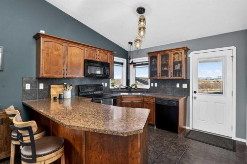 26 Lucky Place, Sylvan Lake, AB - Indoor Photo Showing Kitchen With Double Sink