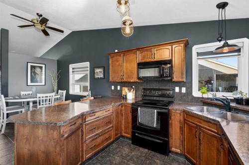26 Lucky Place, Sylvan Lake, AB - Indoor Photo Showing Kitchen With Double Sink