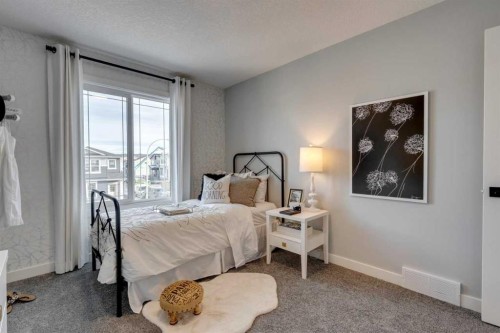 200 Southborough Common, Cochrane, AB - Indoor Photo Showing Bedroom
