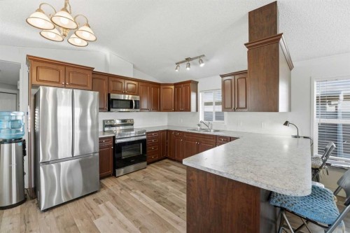 106 Bayshore Drive, Sylvan Lake, AB - Indoor Photo Showing Kitchen With Double Sink