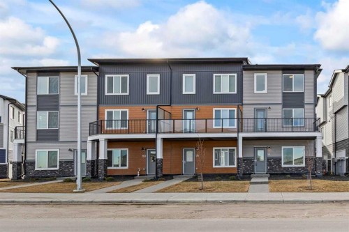 42 Corner Glen Manor Ne, Calgary, AB - Outdoor With Balcony With Facade