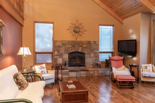 50 Coventry Lane, Lacombe, AB - Indoor Photo Showing Living Room With Fireplace