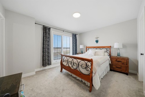 32 Station Drive, Sylvan Lake, AB - Indoor Photo Showing Bedroom