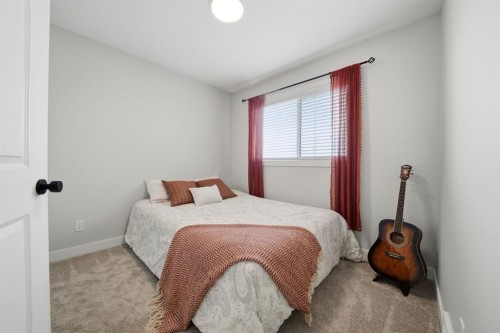 32 Station Drive, Sylvan Lake, AB - Indoor Photo Showing Bedroom