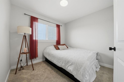32 Station Drive, Sylvan Lake, AB - Indoor Photo Showing Bedroom