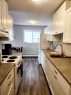 306-4811 55 Street, Red Deer, AB  - Indoor Photo Showing Kitchen With Double Sink 