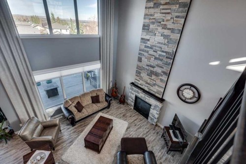 5 Leonard Close, Sylvan Lake, AB - Indoor With Fireplace