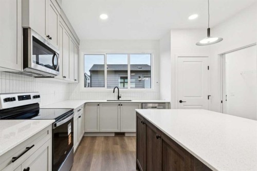 28 Bluerock Terrace Sw, Calgary, AB - Indoor Photo Showing Kitchen With Upgraded Kitchen