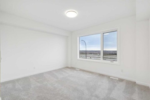 28 Bluerock Terrace Sw, Calgary, AB - Indoor Photo Showing Other Room