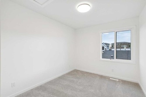 28 Bluerock Terrace Sw, Calgary, AB - Indoor Photo Showing Other Room