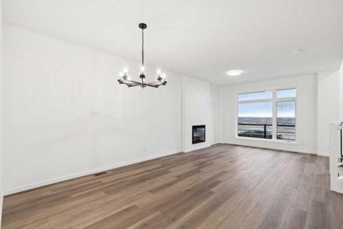 28 Bluerock Terrace Sw, Calgary, AB - Indoor Photo Showing Living Room With Fireplace