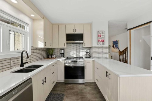 101 Erickson Drive, Red Deer, AB - Indoor Photo Showing Kitchen With Double Sink With Upgraded Kitchen