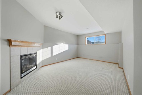 96 Addington Drive, Red Deer, AB - Indoor Photo Showing Other Room With Fireplace