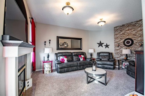 93 Dowler Street, Red Deer, AB - Indoor Photo Showing Living Room With Fireplace