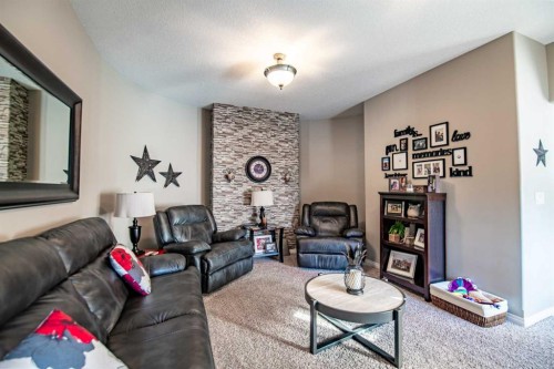 93 Dowler Street, Red Deer, AB - Indoor Photo Showing Living Room With Fireplace