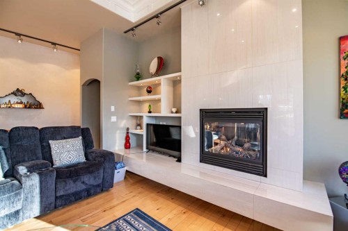 92 Fieldstone Way, Sylvan Lake, AB - Indoor Photo Showing Living Room With Fireplace