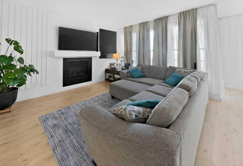 1170 Pacific Circle West, Lethbridge, AB - Indoor Photo Showing Living Room With Fireplace