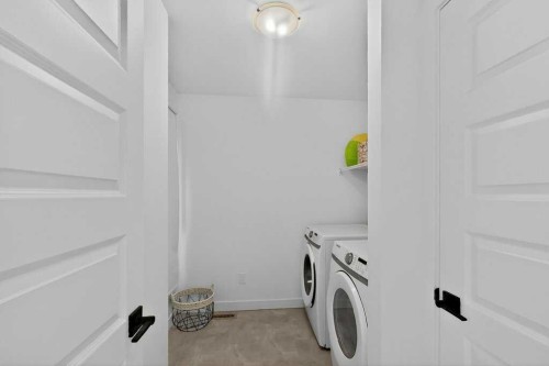 1170 Pacific Circle West, Lethbridge, AB - Indoor Photo Showing Laundry Room