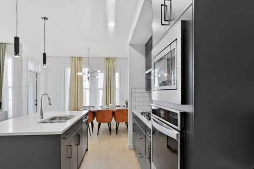 1170 Pacific Circle West, Lethbridge, AB - Indoor Photo Showing Kitchen With Double Sink With Upgraded Kitchen