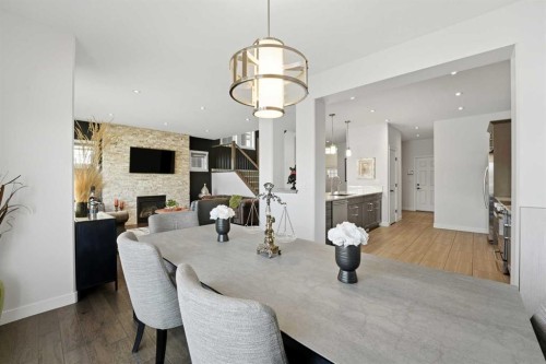 19 Vernon Close, Red Deer, AB - Indoor Photo Showing Dining Room With Fireplace