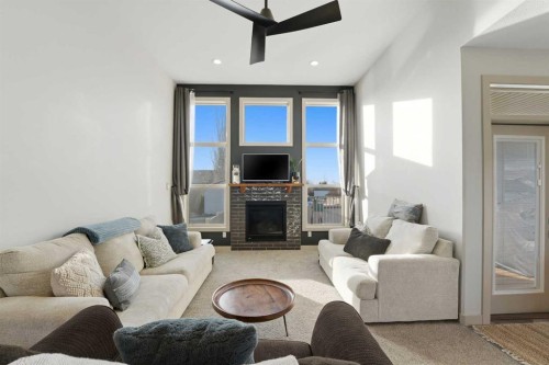 9 Sheep Close, Lacombe, AB - Indoor Photo Showing Living Room With Fireplace