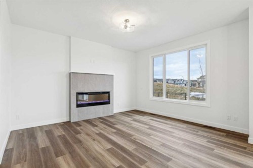 199 Sora Terrace Se, Calgary, AB - Indoor Photo Showing Living Room With Fireplace