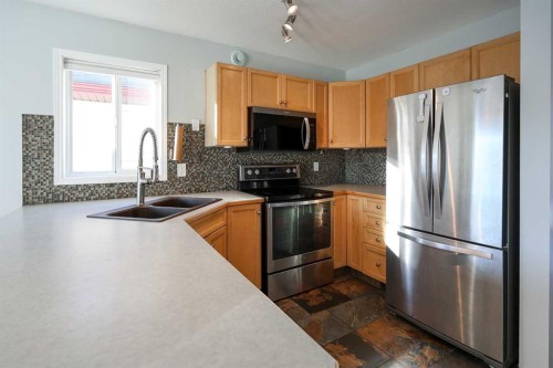 51 Ives Crescent, Red Deer, AB - Indoor Photo Showing Kitchen With Double Sink