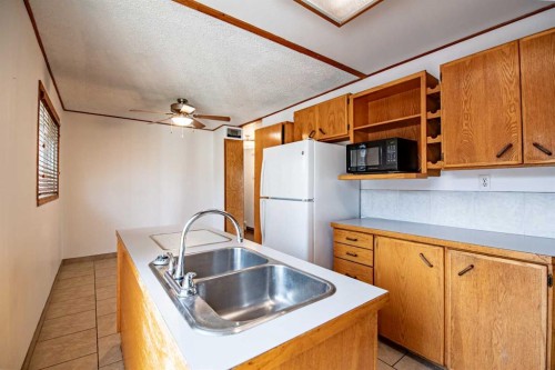 93 Westview Drive, Sylvan Lake, AB - Indoor Photo Showing Kitchen With Double Sink