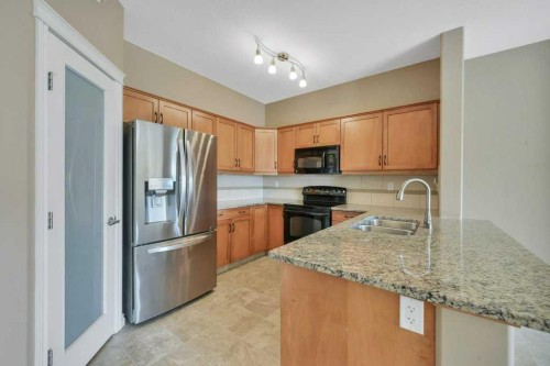 404-6 Michener Boulevard, Red Deer, AB - Indoor Photo Showing Kitchen With Double Sink