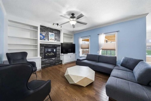 247 Kingston Way Se, Airdrie, AB - Indoor Photo Showing Living Room With Fireplace