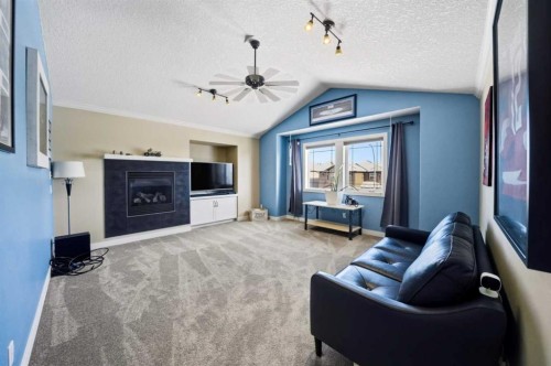 247 Kingston Way Se, Airdrie, AB - Indoor Photo Showing Living Room With Fireplace